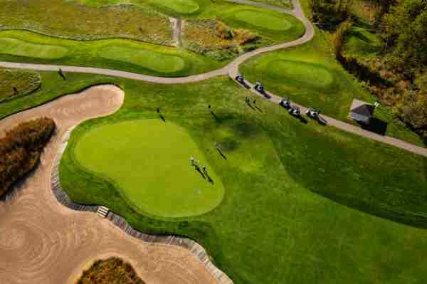 Aerial photographer of golfers on a green at The Meadows Golf Course