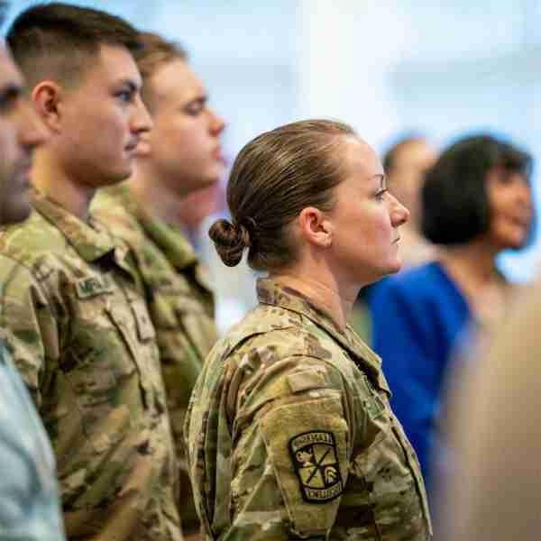 Members of the GVSU ROTC leadership stand at attention during singing of national anthem